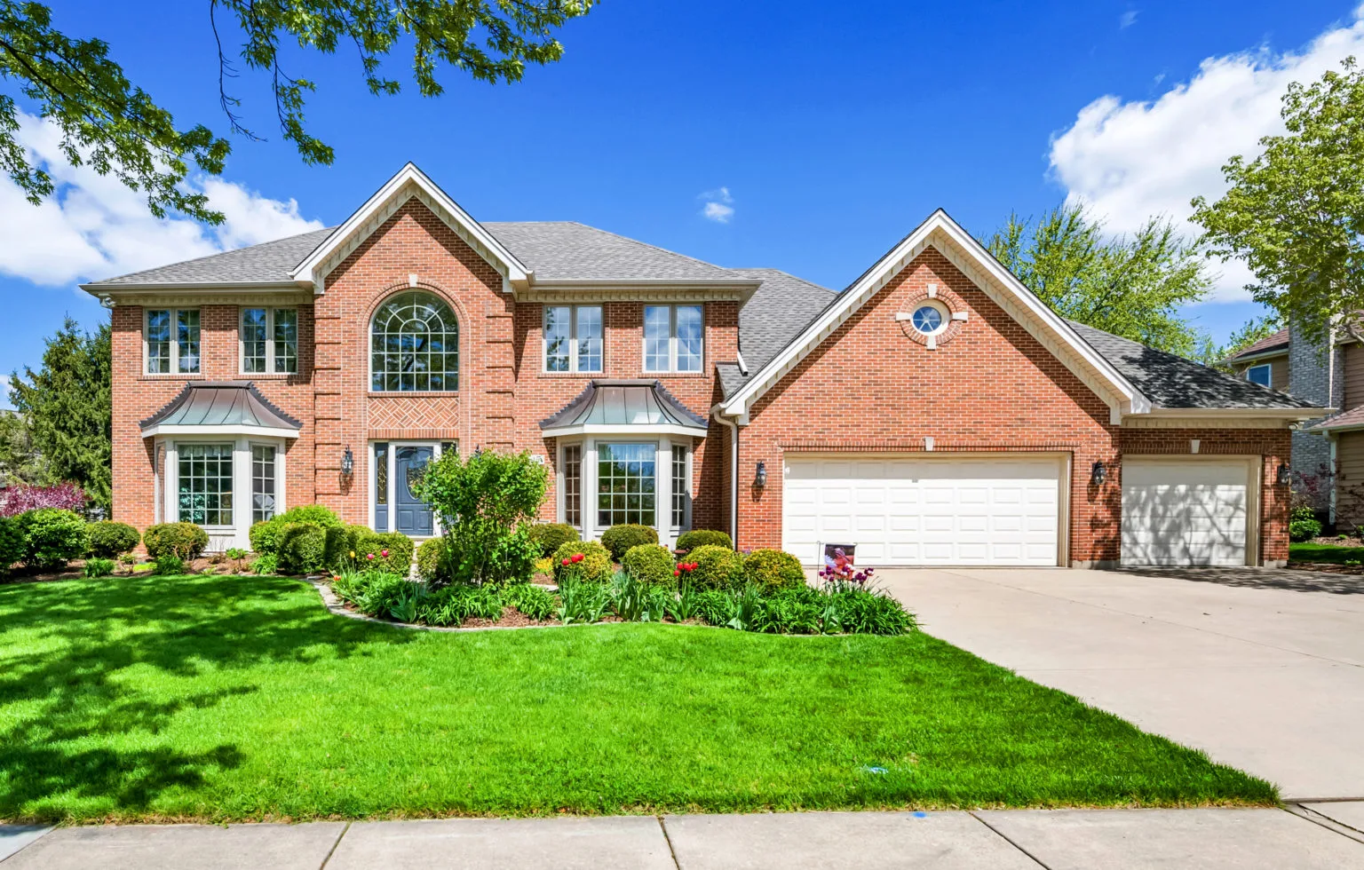 Home Inspection San Antonio by A.I.M. Real Estate Inspections reviewing serene suburban home with well-maintained lawn.